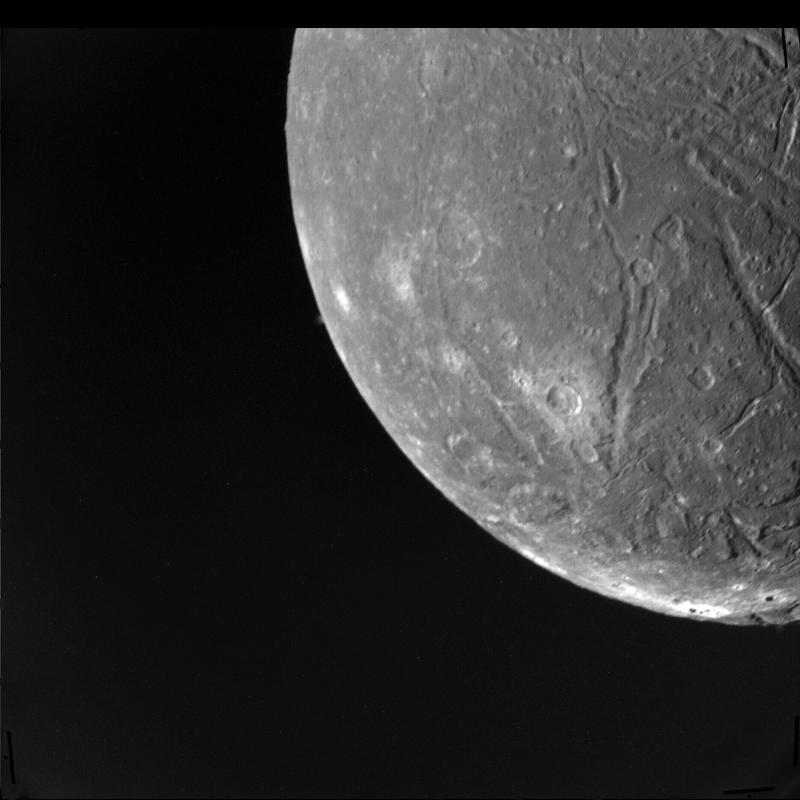 Ariel's fractured surface imaged by Voyager 2 during its closest approach on 24 January 1986, revealing complex tectonic geology.