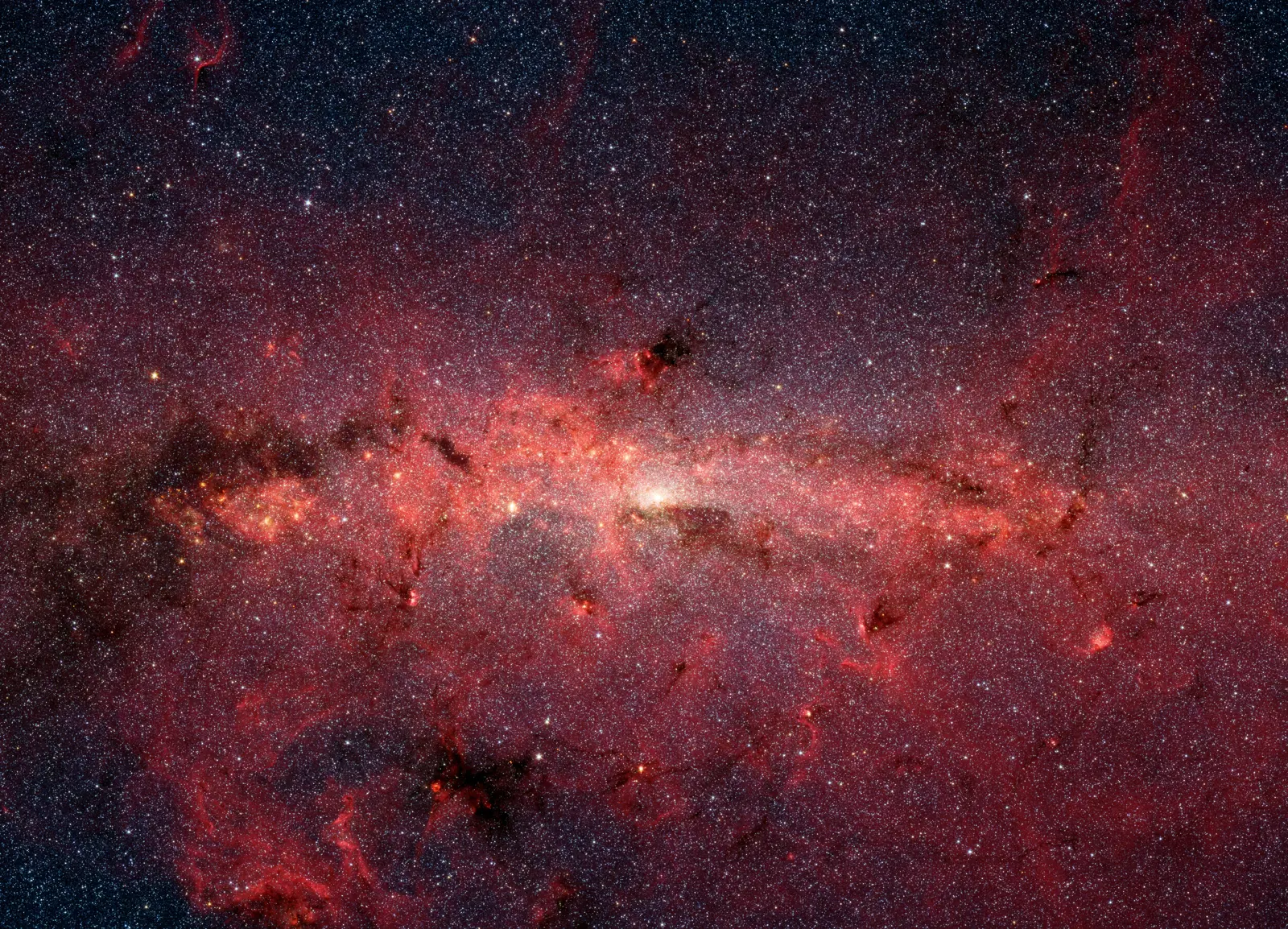 Spitzer Space Telescope infrared view of the Milky Way's galactic centre, revealing hundreds of thousands of stars in the swirling core.