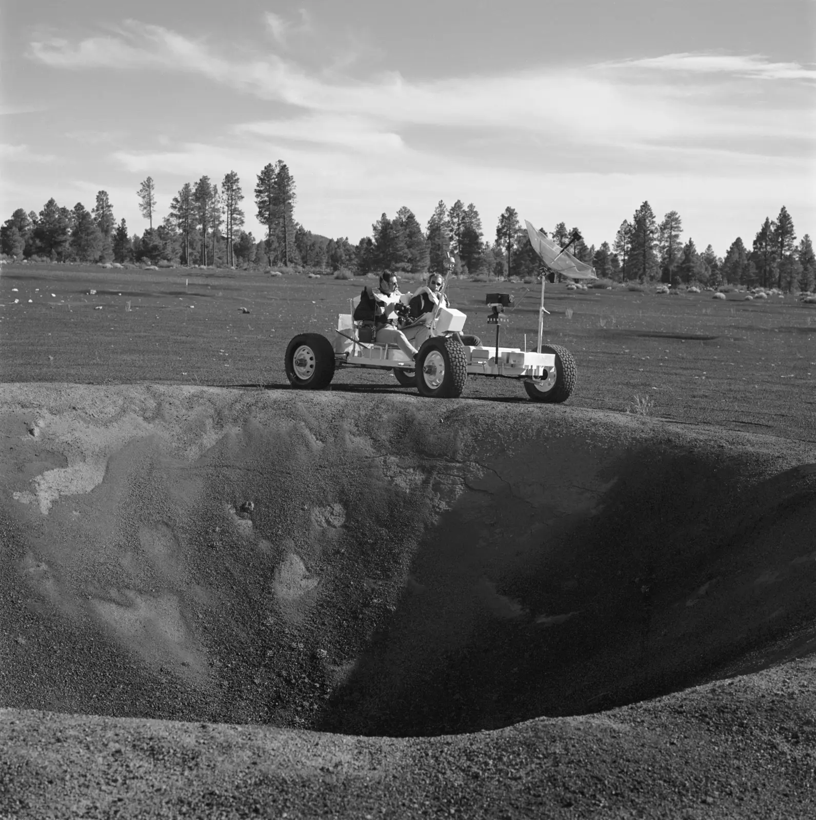 Apollo 15 astronauts David Scott and James Irwin ride the LRV simulator "Grover" at Cinder Lake crater field, Arizona, November 1970.
