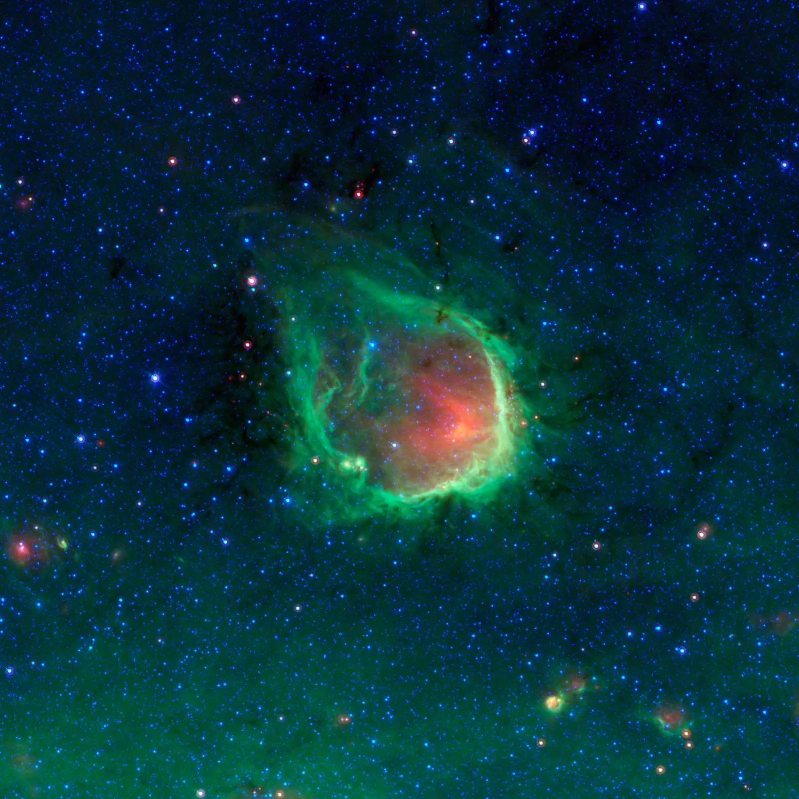 RCW 120, an emission nebula in Scorpius imaged by the Spitzer Space Telescope in infrared. The green ring is ionised gas surrounding a hot star.